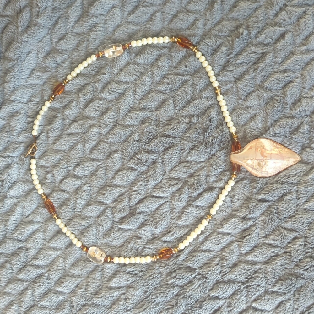 Handmade fashion necklace pearls with a unique pendant.